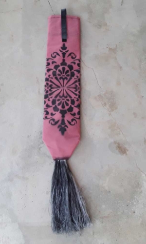 Pink tail bag with black tassle