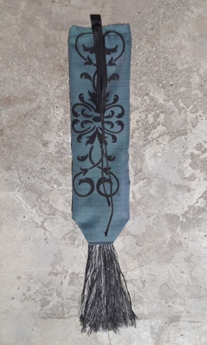 Turquoise tail bag with black tassel